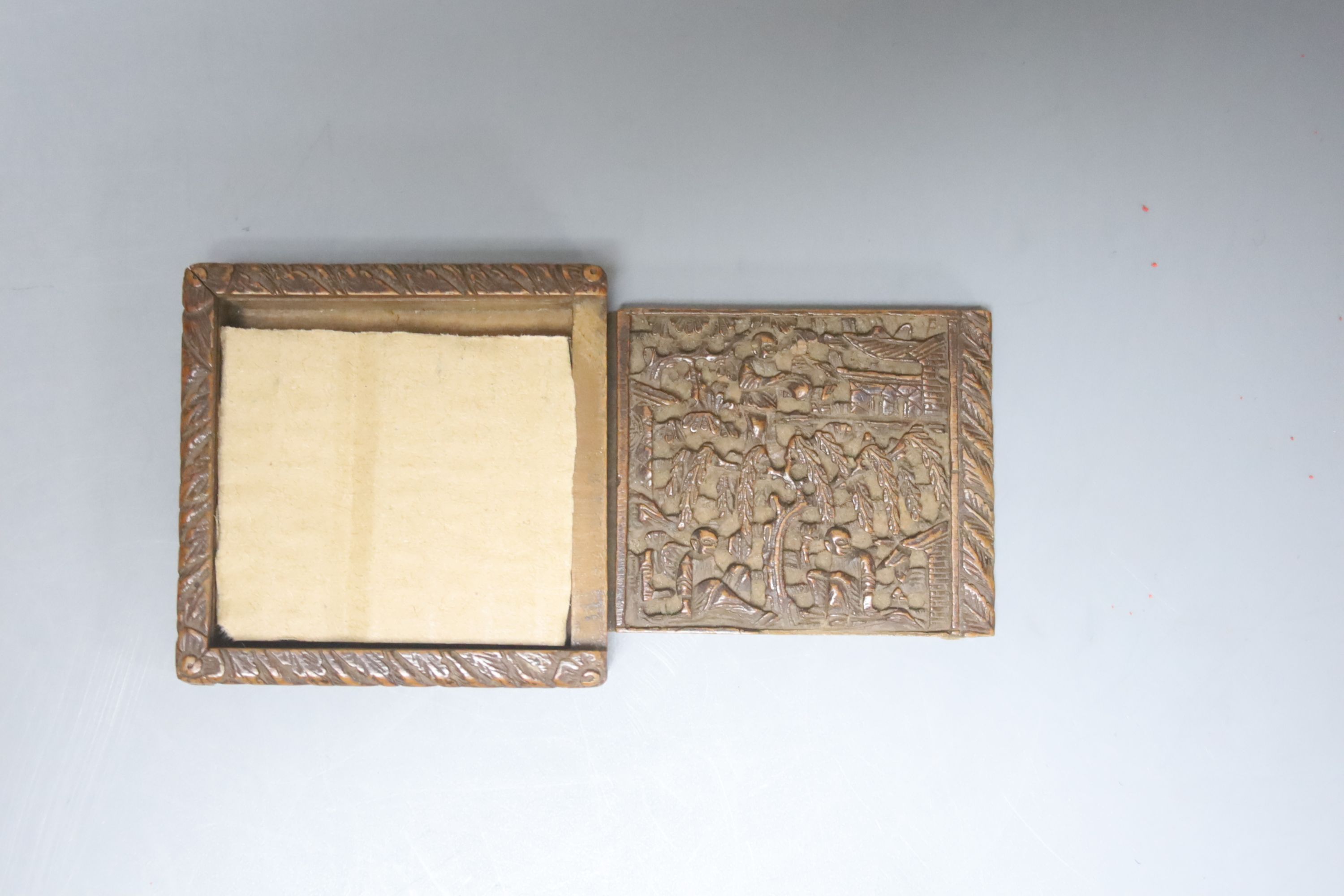 Two 19th century Chinese carved sandalwood boxes, together with a similar puzzle box, length 27cm